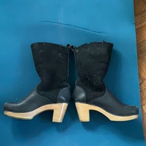 No.6 9" Pull On Shearling Clog Boot on High Heel in Black Suede on tan wood Base